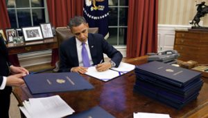 Obama_signing_112414