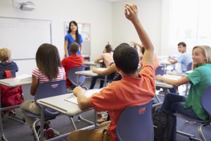 Female High School Teacher Taking Class