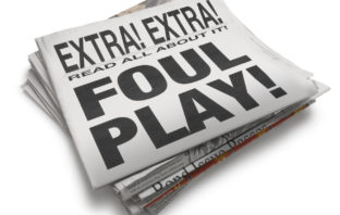 A newspaper with the words "Foul Play."