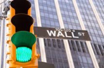 Green traffic light on Wall Street in New York City