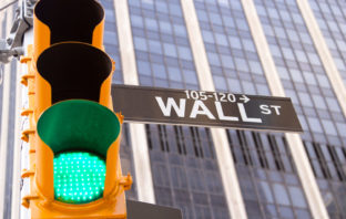 Green traffic light on Wall Street in New York City