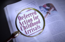 Deferred Action for Childhood Arrivals words under a magnifying glass