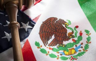 United States and Mexico flags with gavel